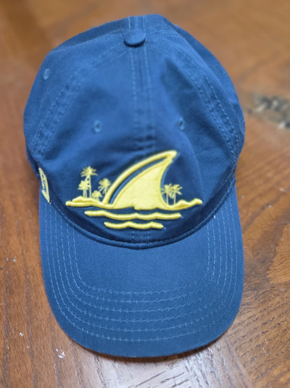 Embroidered Blue Baseball Cap with Yellow Shark Fin Motif